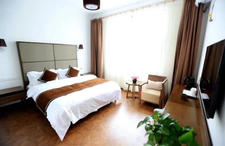 A hotel room with a bed